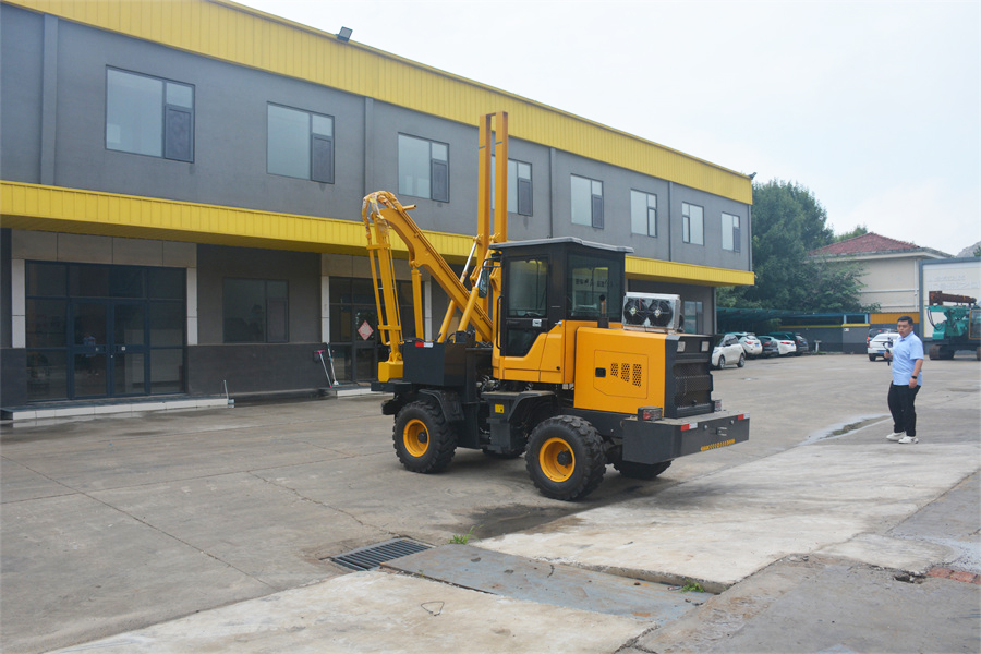 Loader guardrail pile driver